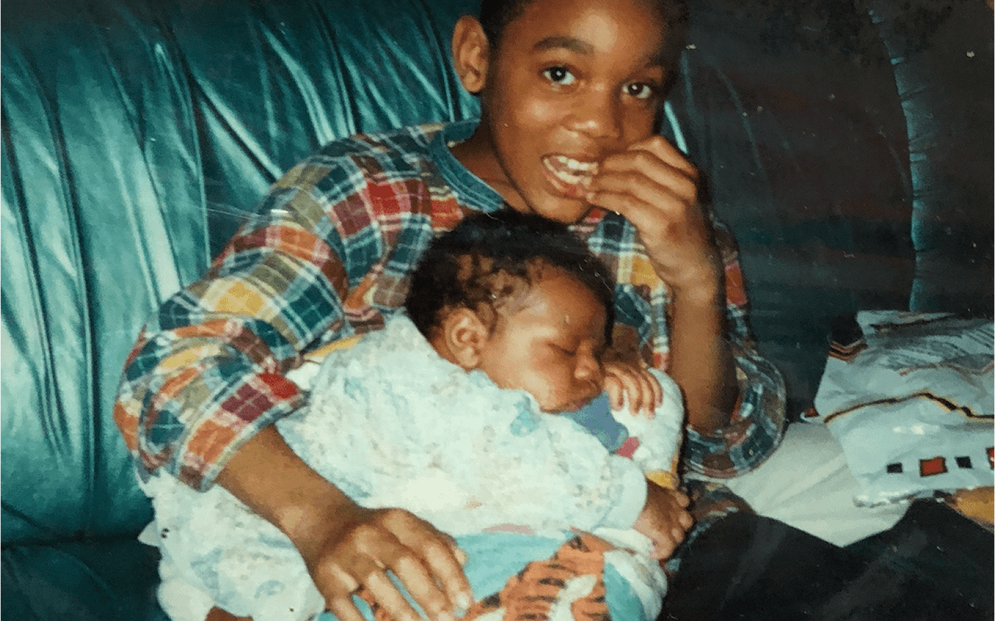 Personal photo of brother holding baby